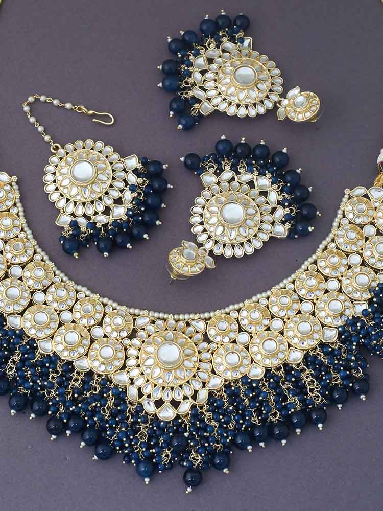 MELANI BORSA KUNDAN JEWELLERY SET WITH MAANGTIKKA