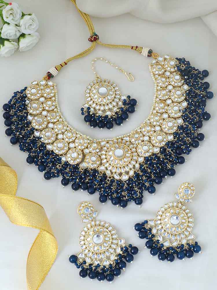 MELANI BORSA KUNDAN JEWELLERY SET WITH MAANGTIKKA